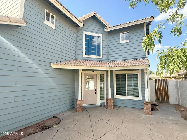 a view of a house with a small space and a large window