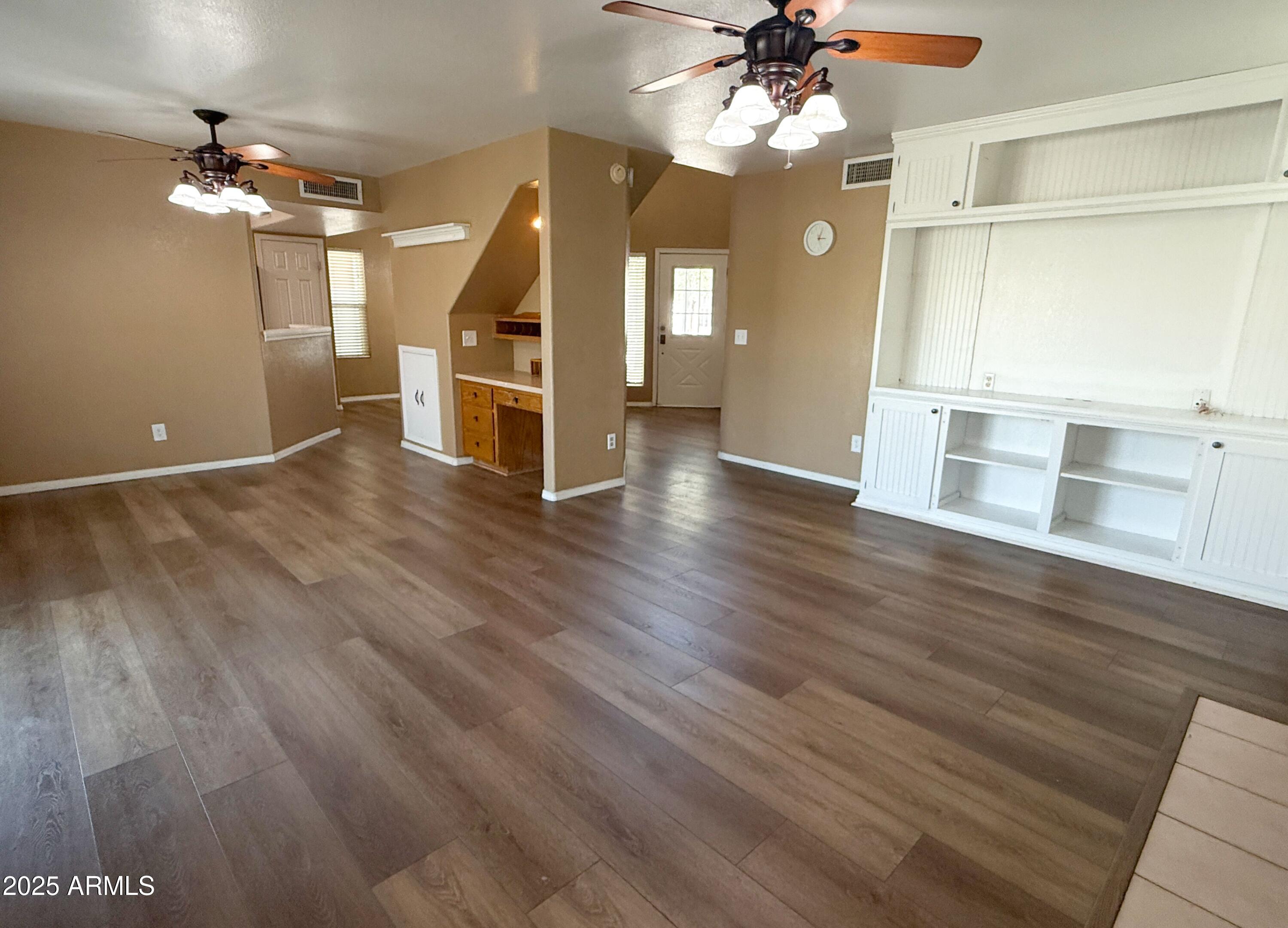 1670 East Gary Drive Chandler, AZ 85225 - Photo 8 of 34 wooden floor in an empty room with a window