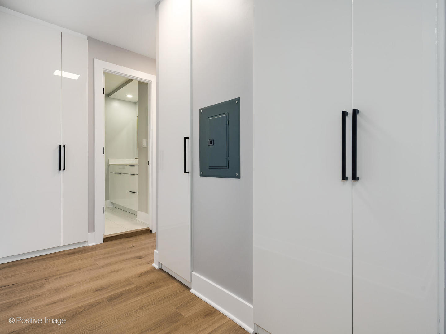 1560 North Sandburg Terrace, Unit 2403J Chicago, IL 60610 - Photo 14 of 45 an empty room with wooden floor and mirror