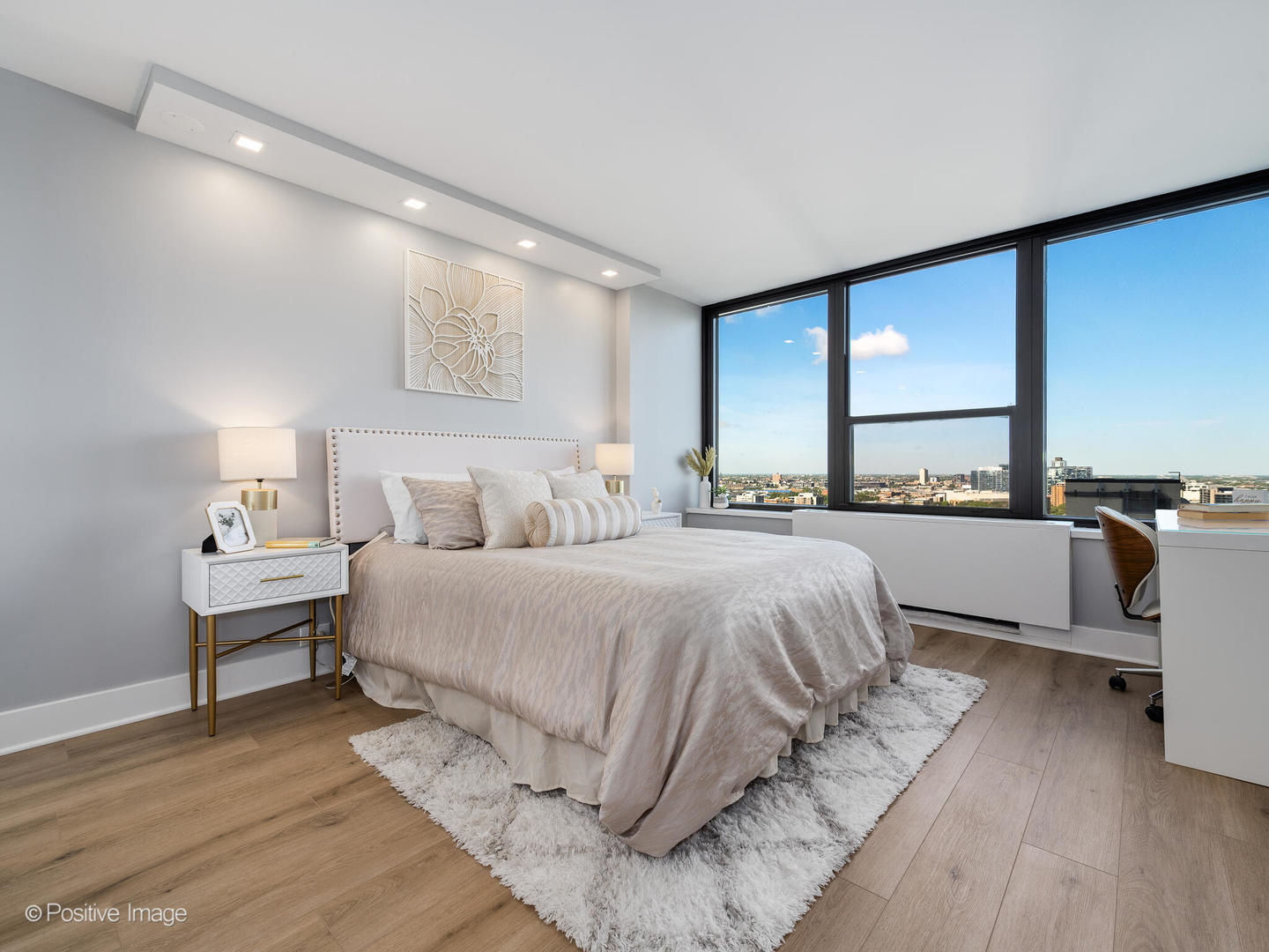 1560 North Sandburg Terrace, Unit 2403J Chicago, IL 60610 - Photo 15 of 45 a bedroom with a bed and a large window