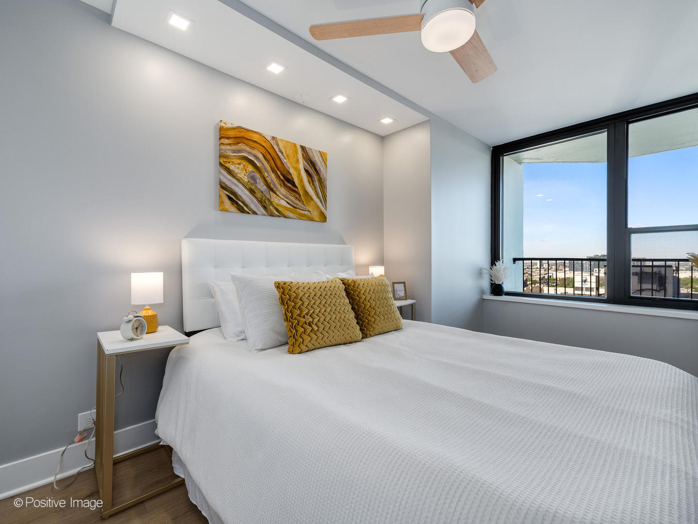 1560 North Sandburg Terrace, Unit 2403J Chicago, IL 60610 - Photo 22 of 45 a bedroom with a bed and a large window