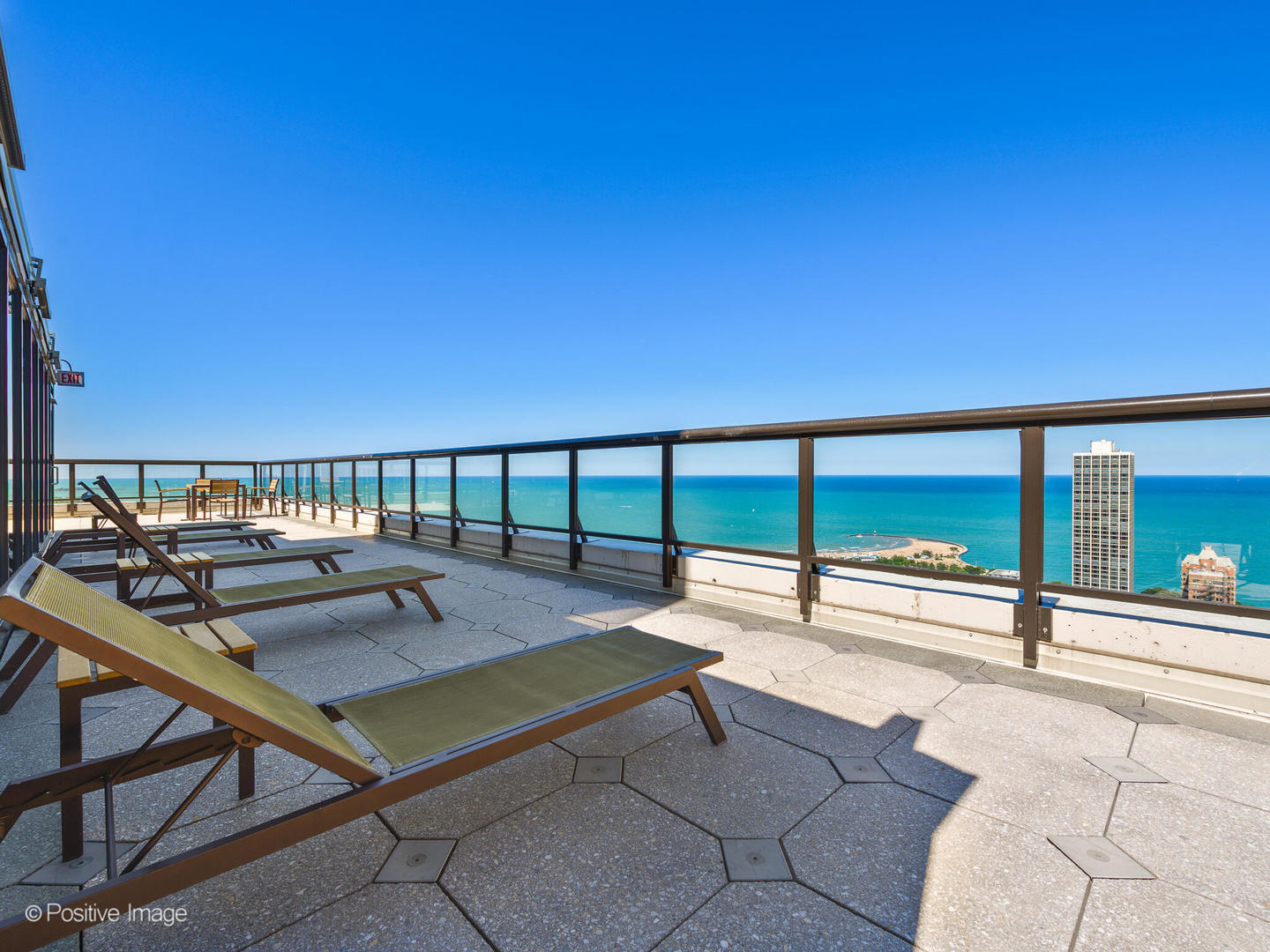 1560 North Sandburg Terrace, Unit 2403J Chicago, IL 60610 - Photo 27 of 45 a view of a swimming pool with a lounge chair