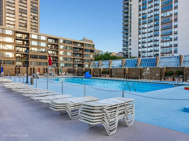a view of a swimming pool with a patio