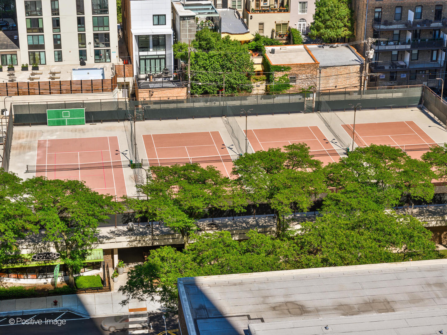 1560 North Sandburg Terrace, Unit 2403J Chicago, IL 60610 - Photo 34 of 45 a view of a swimming pool with a patio
