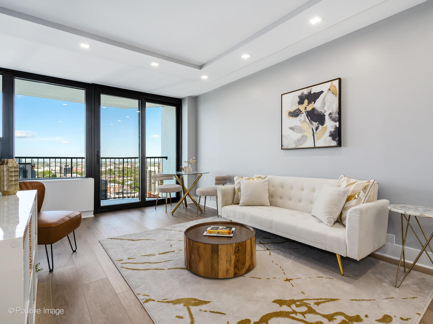 1560 North Sandburg Terrace, Unit 2403J Chicago, IL 60610 - Photo 6 of 45 a living room with furniture and a floor to ceiling window