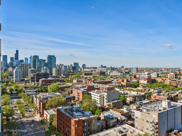 a view of a city with tall buildings