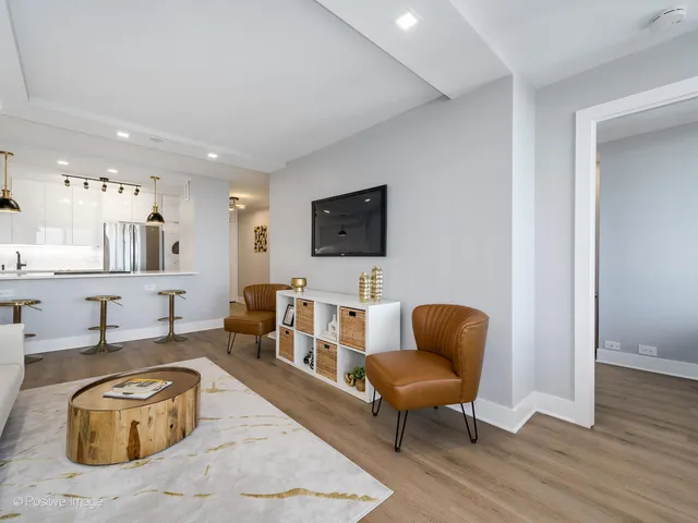 a living room with furniture and a chair