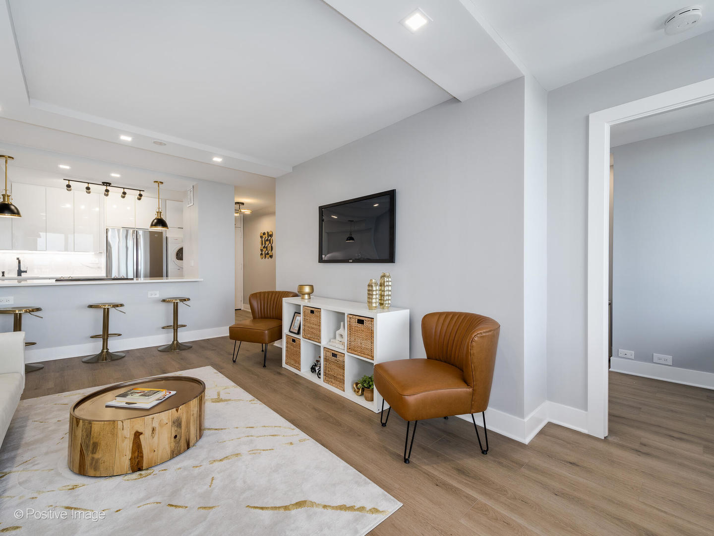 1560 North Sandburg Terrace, Unit 2403J Chicago, IL 60610 - Photo 10 of 45 a living room with furniture and a chair