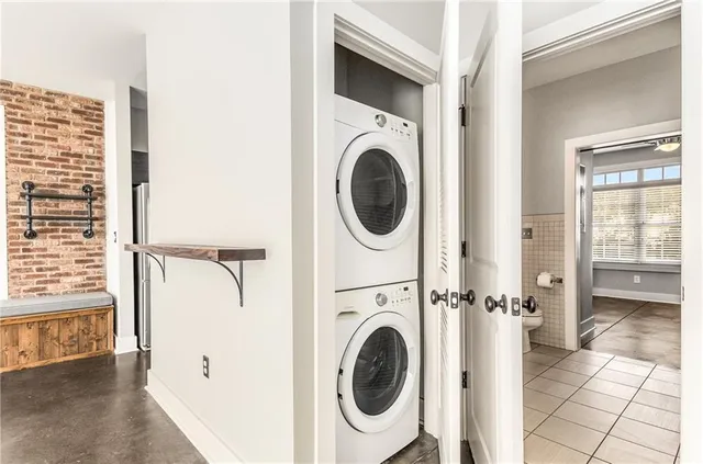 a view of a hallway with washer and dryer