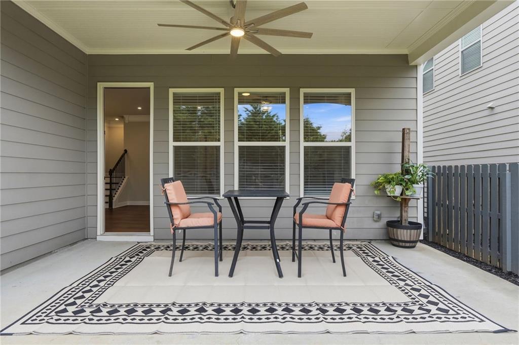 2070 Abbey Road Roswell, GA 30076 - Photo 30 of 65 a view of a patio with a table and chairs