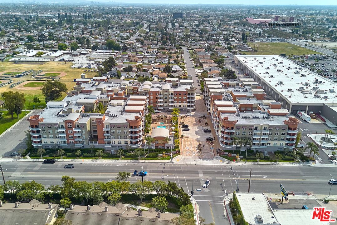 12664 Chapman Avenue, Unit 1208 Garden Grove, CA 92840 - Photo 1 of 29 an aerial view of residential building and lake view