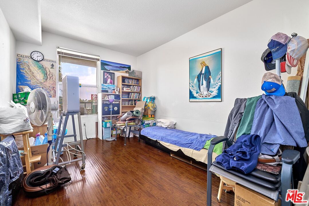 12664 Chapman Avenue, Unit 1208 Garden Grove, CA 92840 - Photo 12 of 29 a living room with furniture and wooden floor