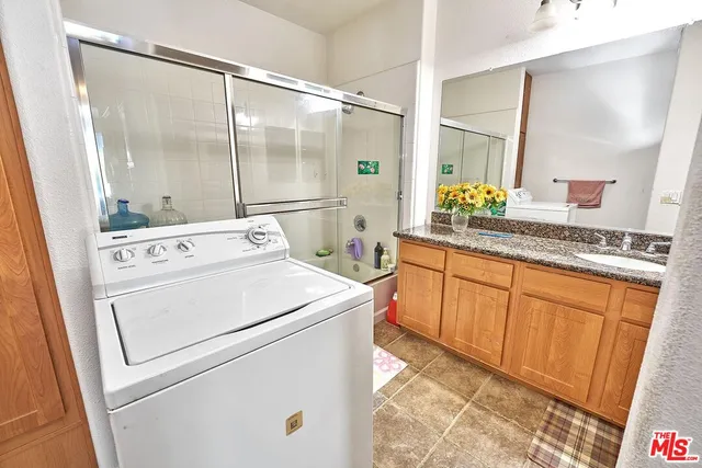 a view of washer and dryer with a mirror