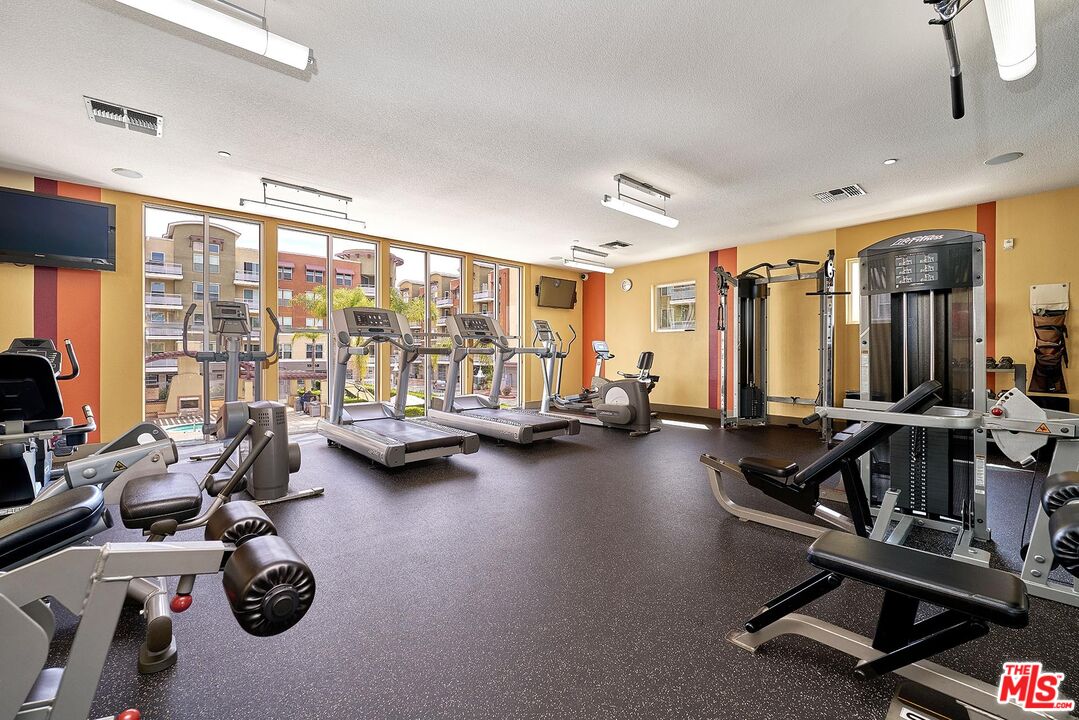 12664 Chapman Avenue, Unit 1208 Garden Grove, CA 92840 - Photo 22 of 29 a view of a room with gym equipment