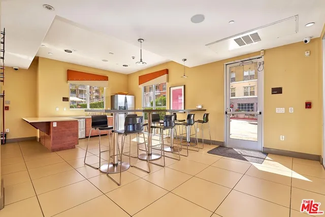 a room with lots of tables and chairs