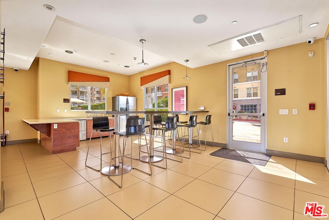 12664 Chapman Avenue, Unit 1208 Garden Grove, CA 92840 - Photo 23 of 29 a room with lots of tables and chairs