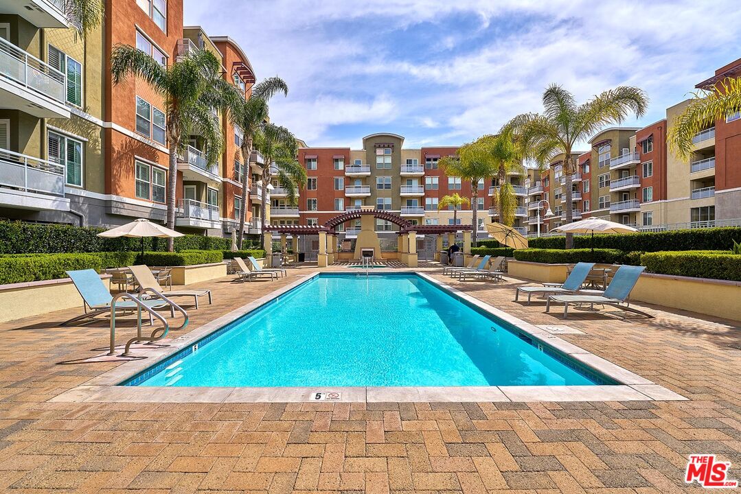 12664 Chapman Avenue, Unit 1208 Garden Grove, CA 92840 - Photo 26 of 29 a view of swimming pool with outdoor seating