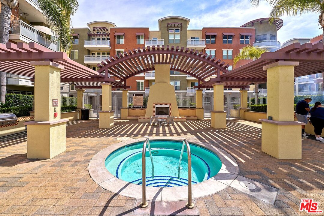 12664 Chapman Avenue, Unit 1208 Garden Grove, CA 92840 - Photo 27 of 29 a front view of a house with a yard