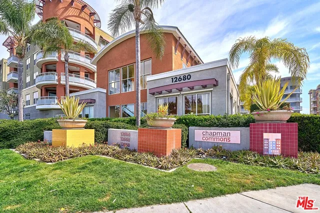 a view of a house with a yard and plants