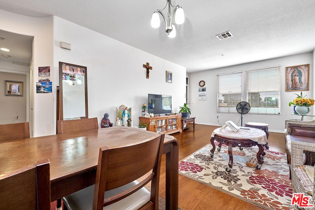 12664 Chapman Avenue, Unit 1208 Garden Grove, CA 92840 - Photo 9 of 29 a view of a dining room with furniture