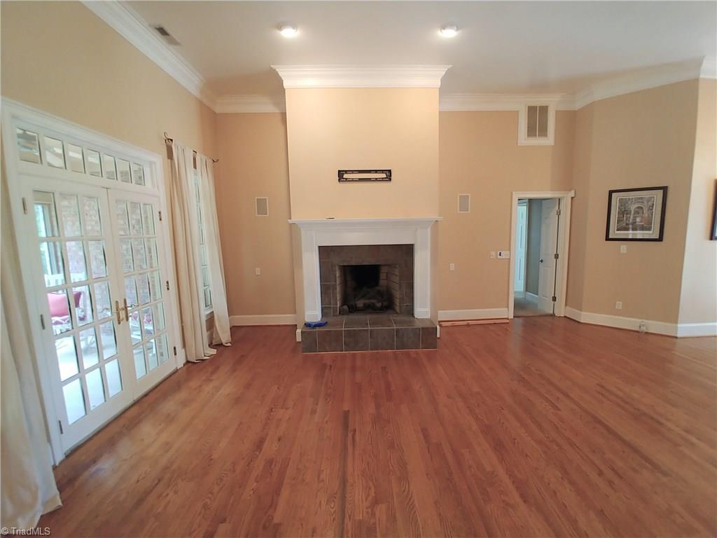 354 George Murphy Road Winston-Salem, NC 27107 - Photo 14 of 29 Living room, fireplace, entrance to screened porch.