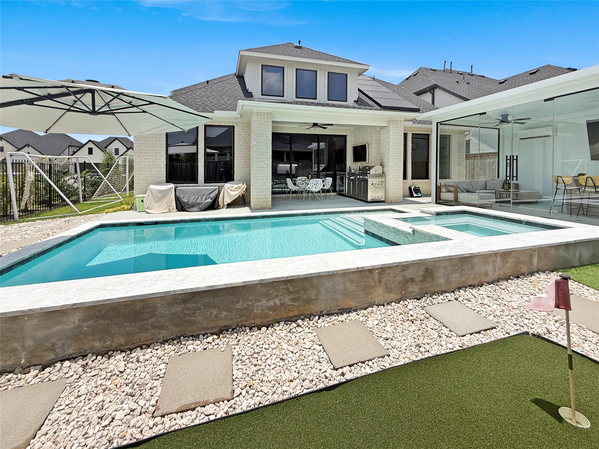 26918 Swanborough Road Spring, TX 77389 - Photo 34 of 50 This backyard resort features a Grand Effects spa with cascading water features, a private putting green, an air-conditioned enclosed gazebo, and multiple covered patio areas for entertaining.
