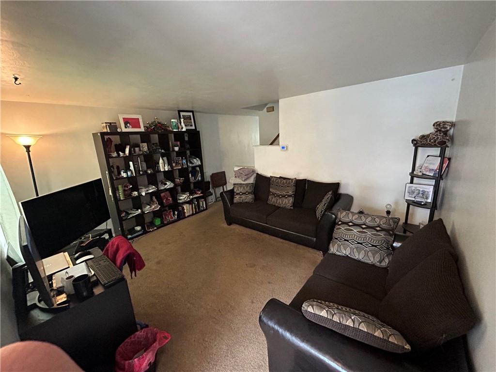 330B Moon Clinton Road, Unit A Coraopolis, PA 15108 - Photo 3 of 18 a living room with furniture and a flat screen tv