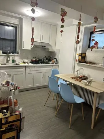 a view of kitchen with dining table and chairs