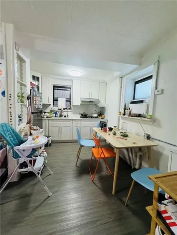 a bathroom with a sink toilet and a mirror