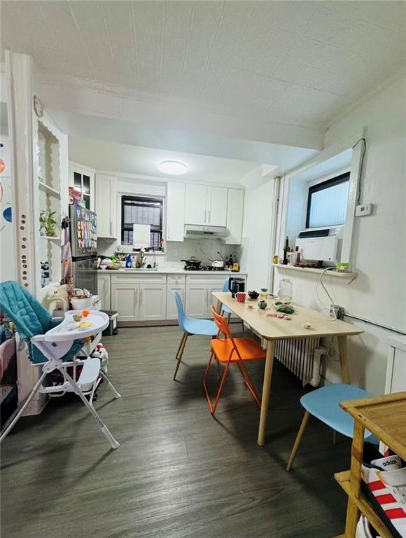 1253 70th Street Brooklyn, NY 11228 - Photo 9 of 13 a view of kitchen with dining table and chairs