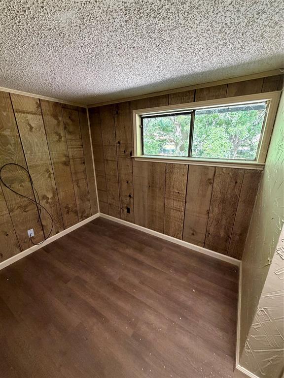 257 West Acres Road Gun Barrel City, TX 75156 - Photo 14 of 22 wooden floor in an empty room with a window