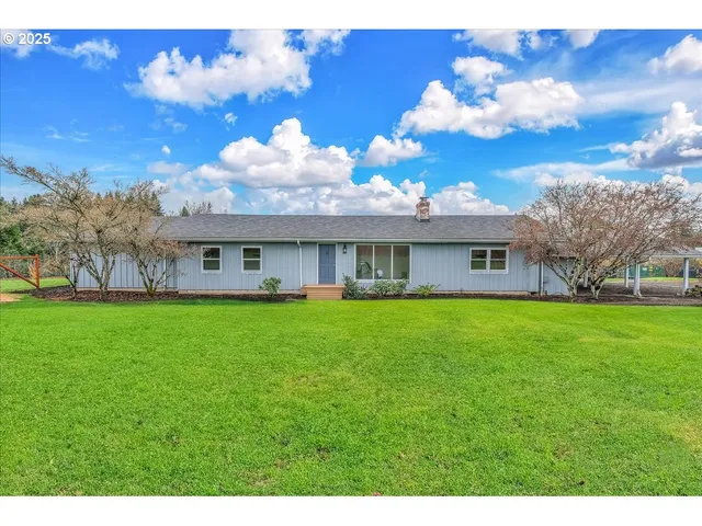 a view of a house with a big yard