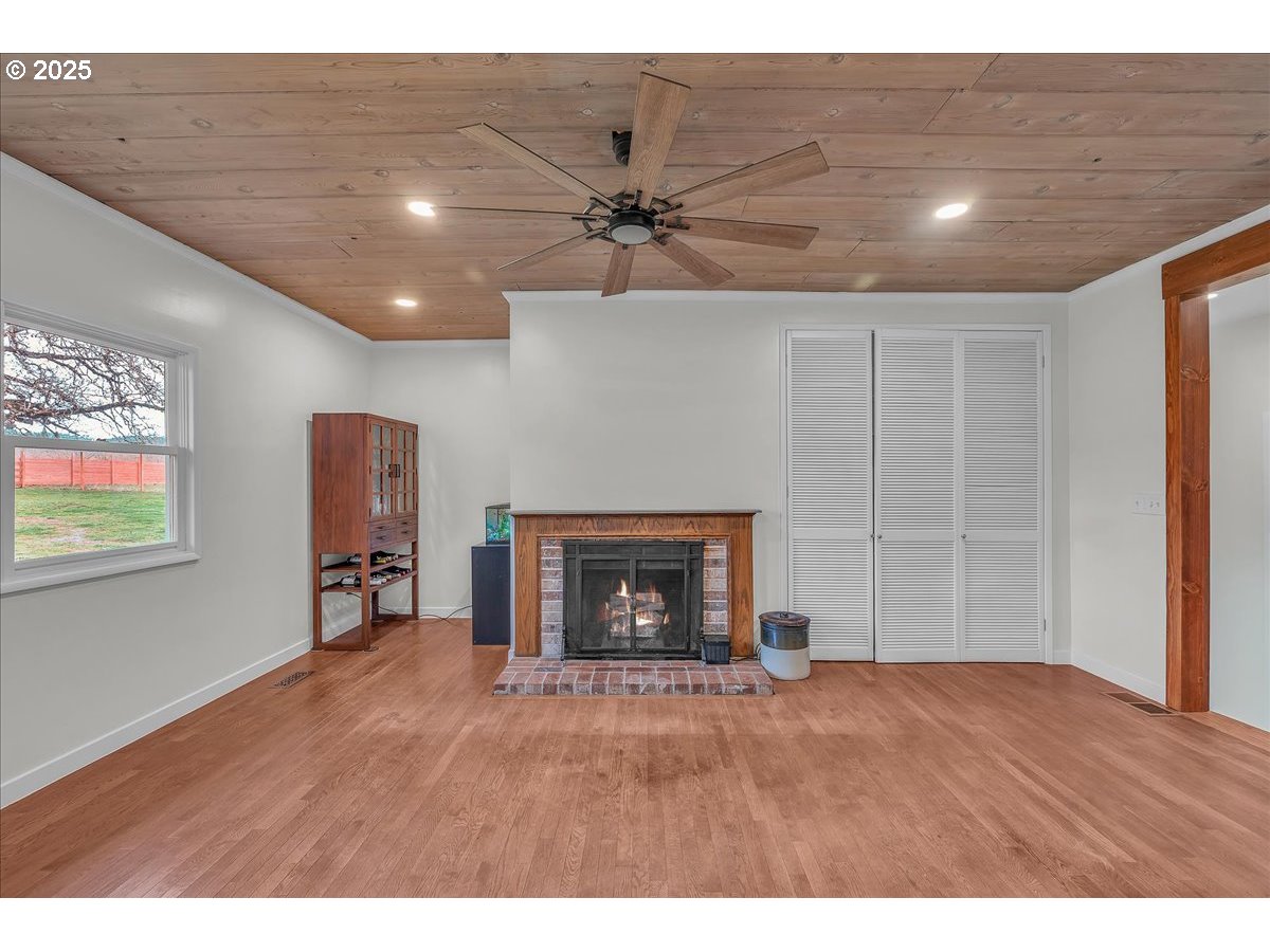 19448 Southwest Scholls Ferry Road Beaverton, OR 97007 - Photo 18 of 45 a view of an empty room with a fireplace