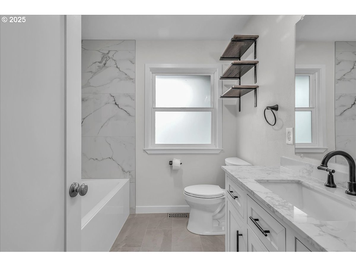 19448 Southwest Scholls Ferry Road Beaverton, OR 97007 - Photo 26 of 45 a bathroom with a sink toilet tub and shower