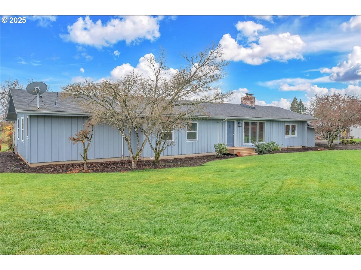 19448 Southwest Scholls Ferry Road Beaverton, OR 97007 - Photo 3 of 45 a backyard of a house with table and chairs