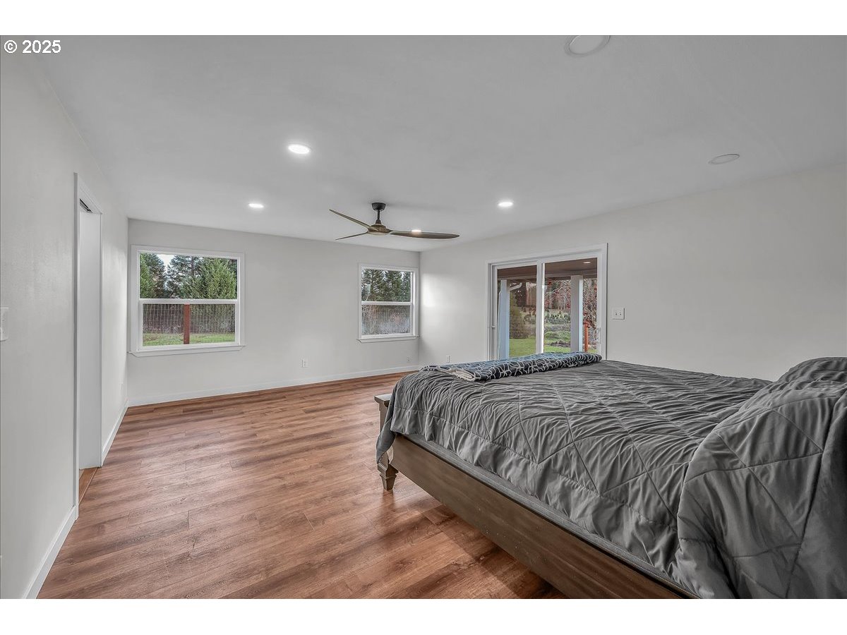 19448 Southwest Scholls Ferry Road Beaverton, OR 97007 - Photo 32 of 45 a bedroom with a bed and a window