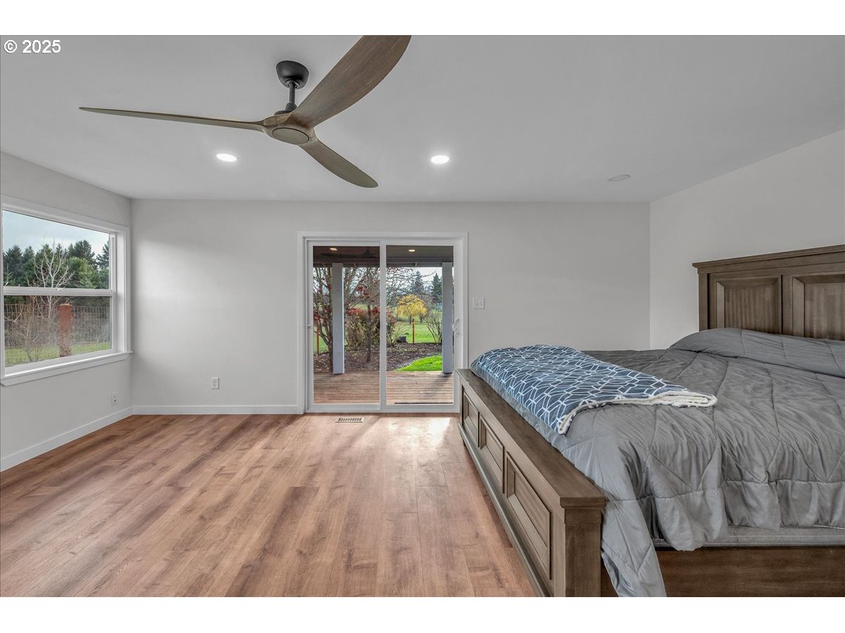 19448 Southwest Scholls Ferry Road Beaverton, OR 97007 - Photo 33 of 45 a bedroom with a large bed and a large window