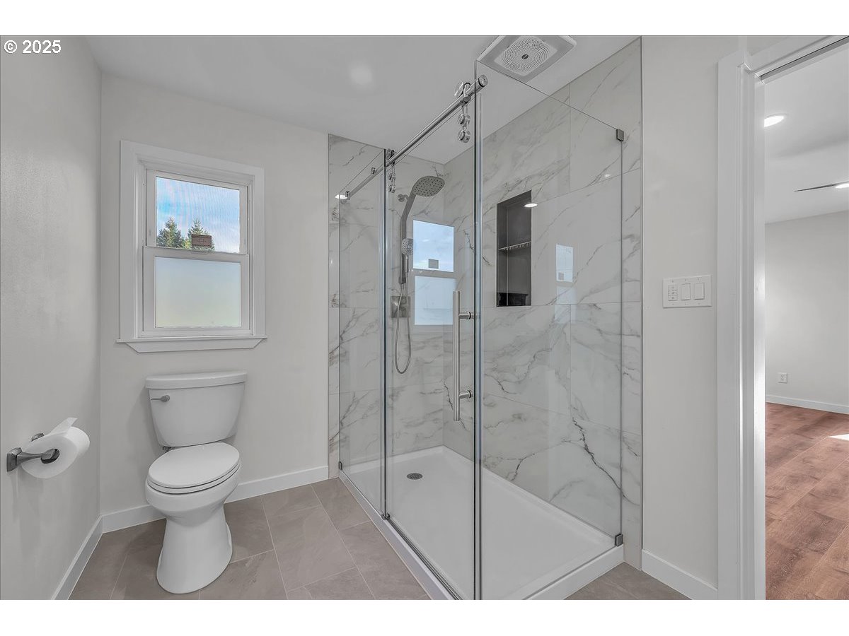 19448 Southwest Scholls Ferry Road Beaverton, OR 97007 - Photo 35 of 45 a bathroom with a toilet and a shower