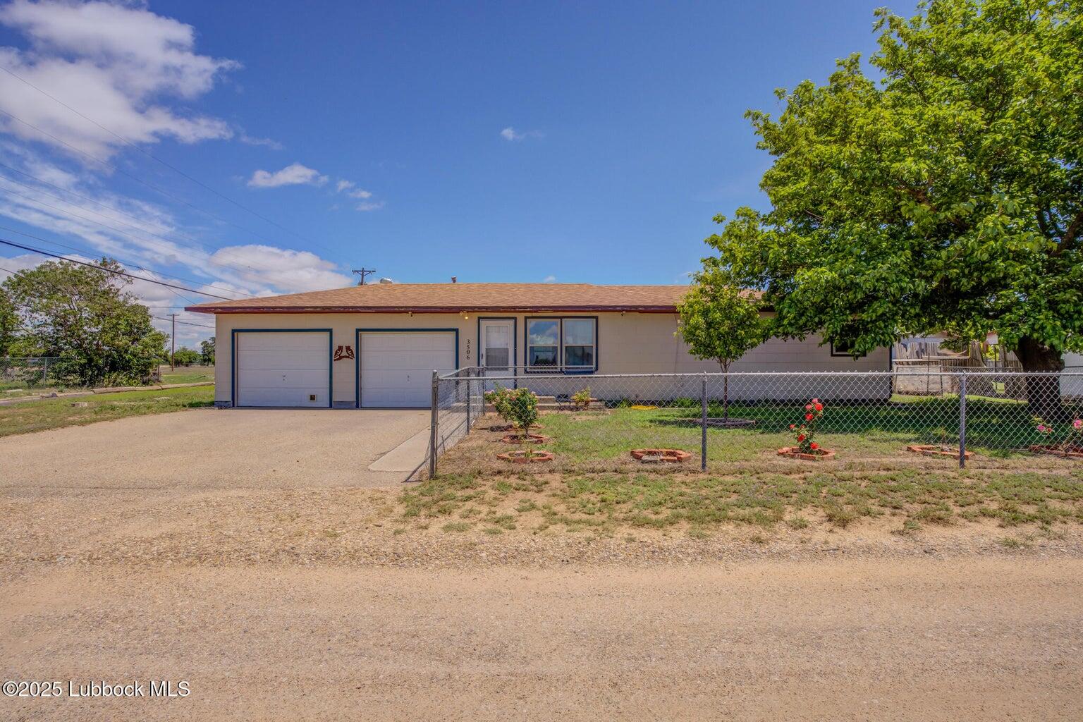 3506 Elm Avenue Lubbock, TX 79404 - Photo 1 of 12 a view of a house with a yard and tree