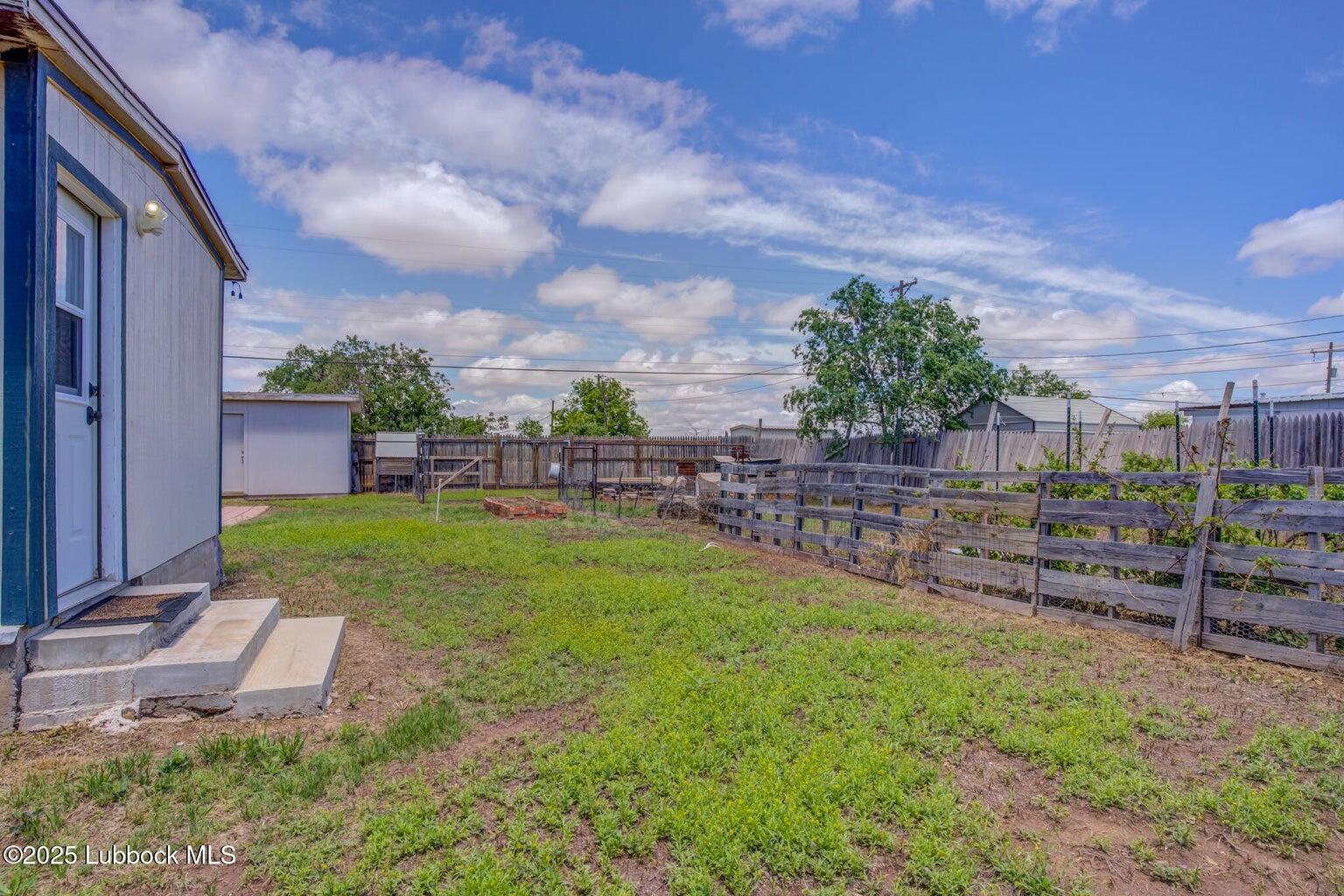 3506 Elm Avenue Lubbock, TX 79404 - Photo 11 of 12 a view of a backyard with sitting area