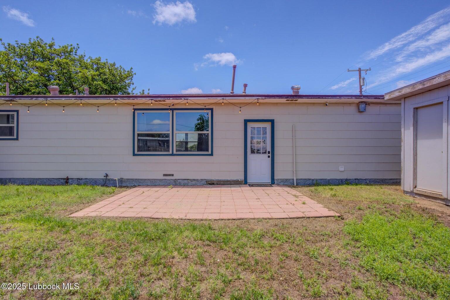3506 Elm Avenue Lubbock, TX 79404 - Photo 12 of 12 a front view of a house with a yard