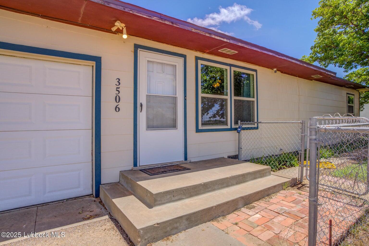 3506 Elm Avenue Lubbock, TX 79404 - Photo 2 of 12 a front view of a house with a porch