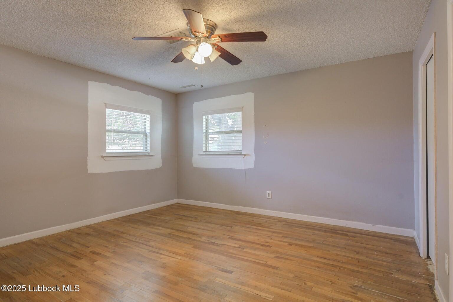 3506 Elm Avenue Lubbock, TX 79404 - Photo 7 of 12 a view of an empty room with a window