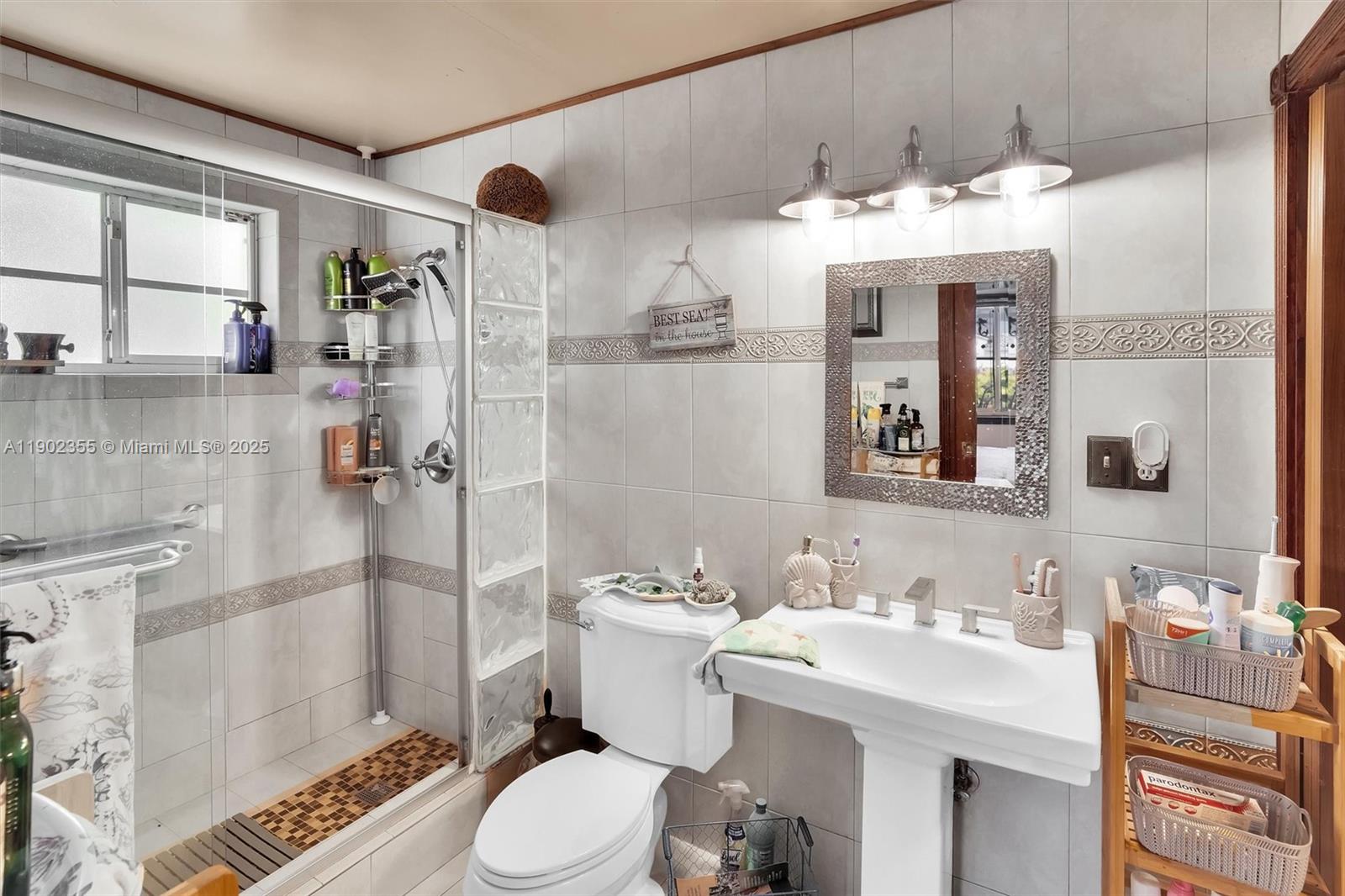 11035 Southwest 148th Place Miami, FL 33196 - Photo 22 of 48 a bathroom with a sink toilet and shower