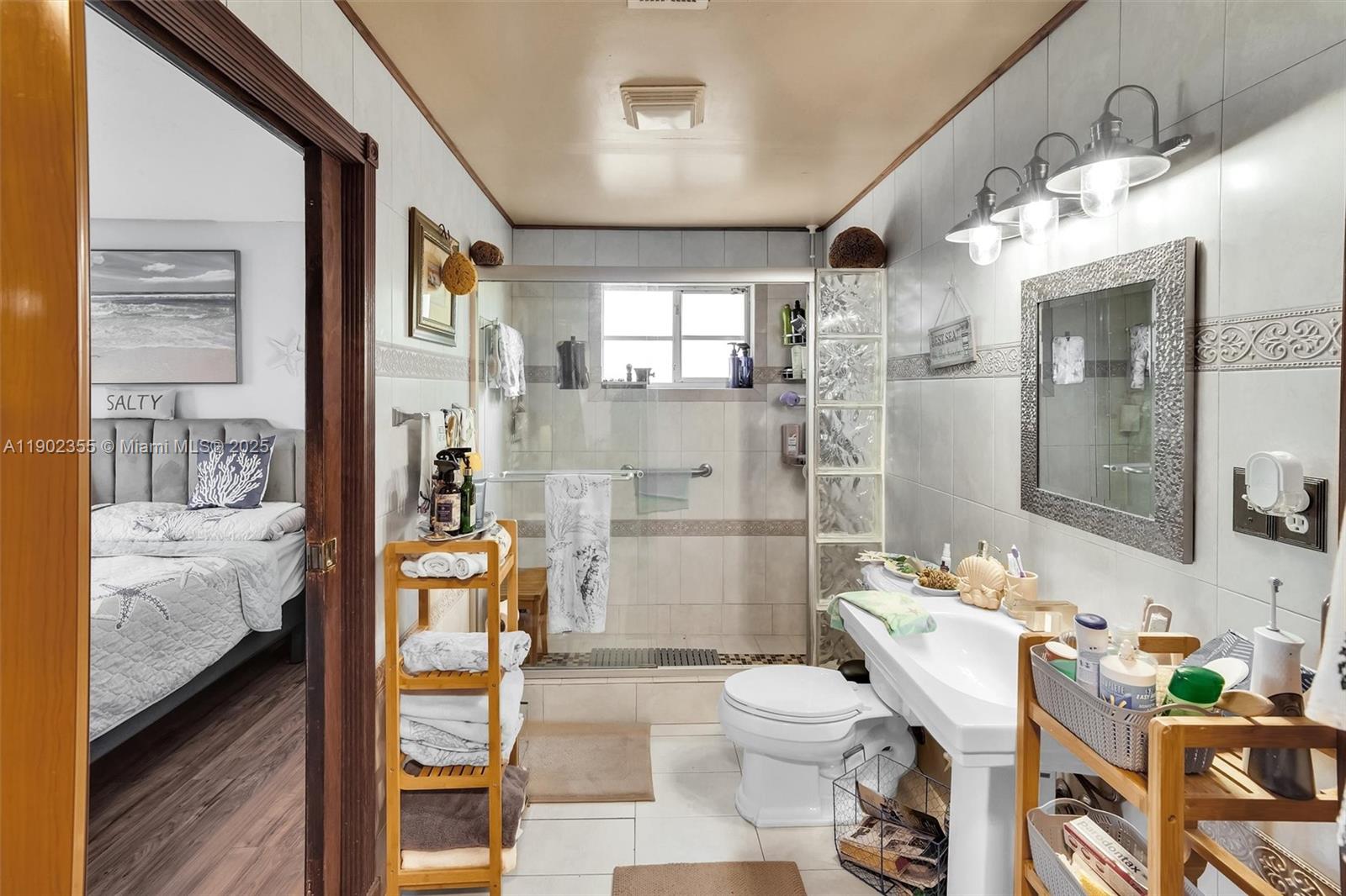 11035 Southwest 148th Place Miami, FL 33196 - Photo 23 of 48 a bathroom with a sink toilet and shower