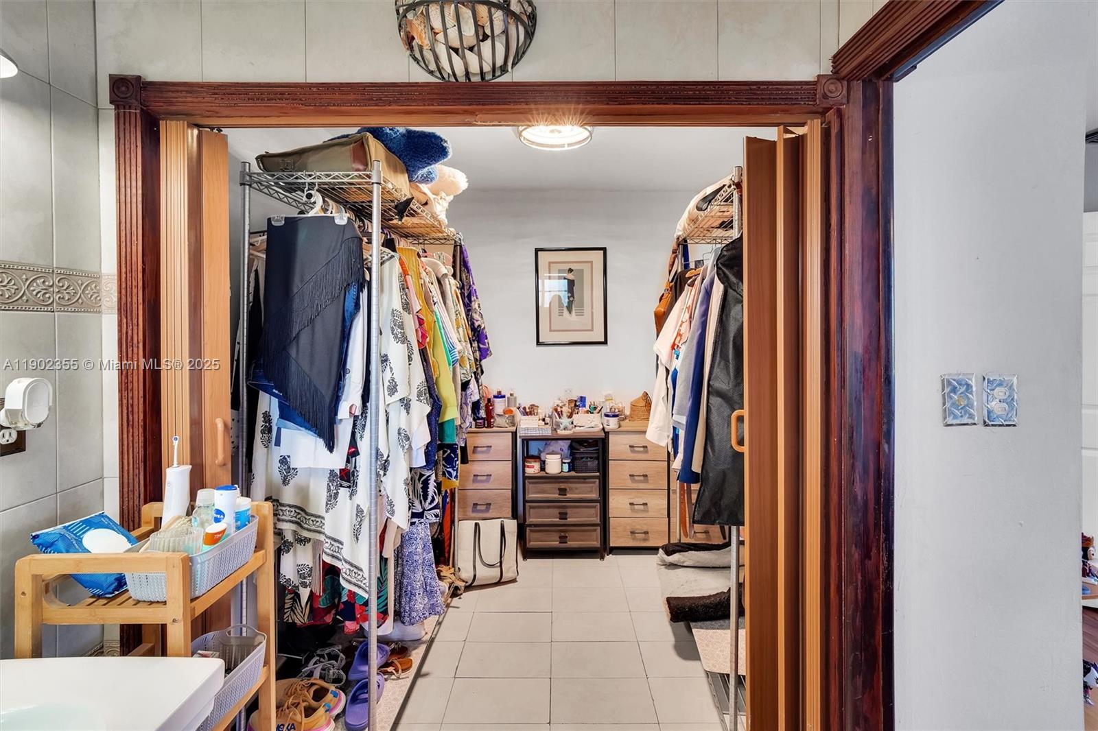 11035 Southwest 148th Place Miami, FL 33196 - Photo 24 of 48 a view of walk in closet with clothes and shoes