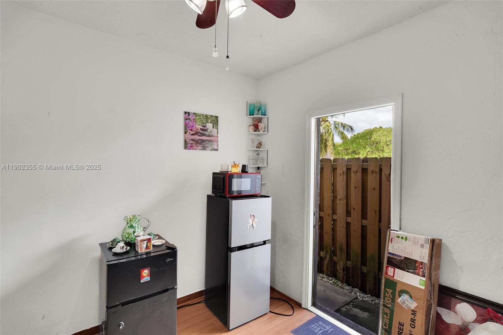 11035 Southwest 148th Place Miami, FL 33196 - Photo 35 of 48 a kitchen with a refrigerator and cabinets