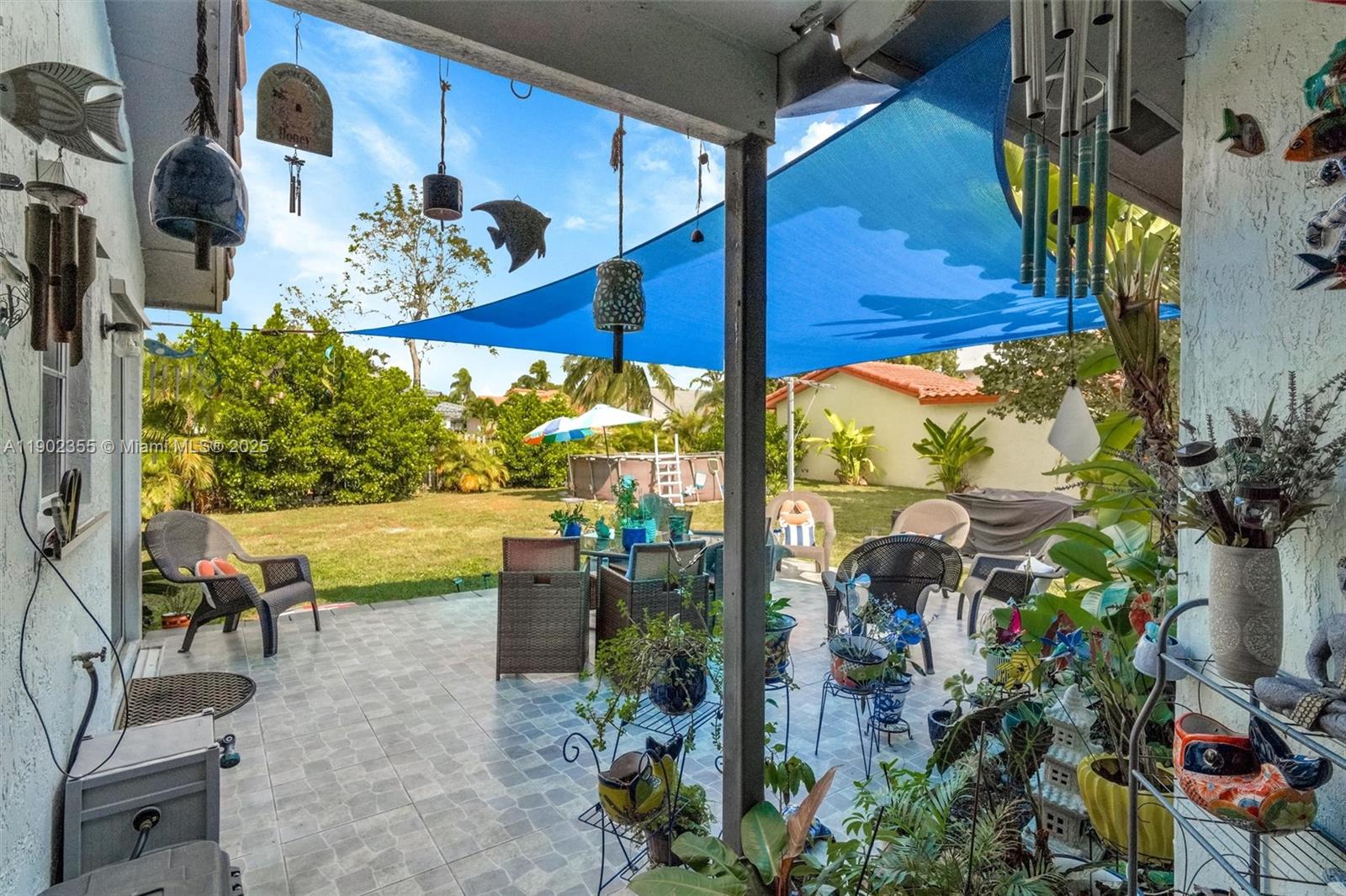 11035 Southwest 148th Place Miami, FL 33196 - Photo 36 of 48 a view of a dining room with furniture water view and a floor to ceiling window