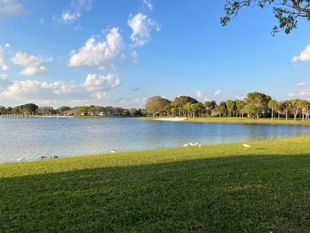 11035 Southwest 148th Place Miami, FL 33196 - Photo 41 of 48 a view of a lake with houses in the back