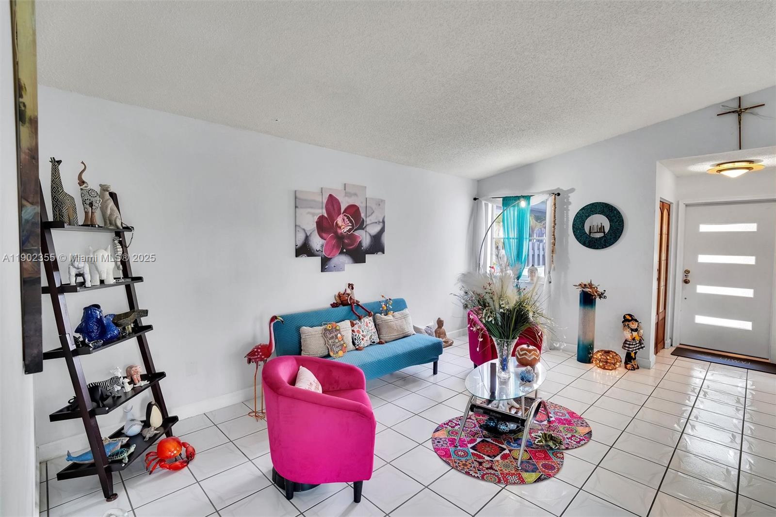 11035 Southwest 148th Place Miami, FL 33196 - Photo 8 of 48 a living room with furniture and a flat screen tv